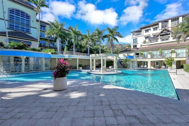 view of swimming pool featuring a patio area and pool water feature