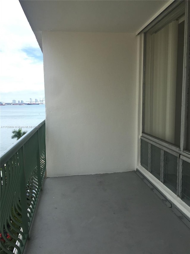 balcony featuring a water view