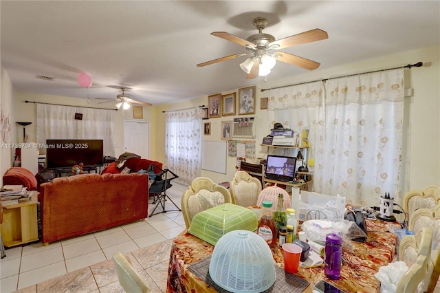 living room featuring ceiling fan and light tile patterned floors