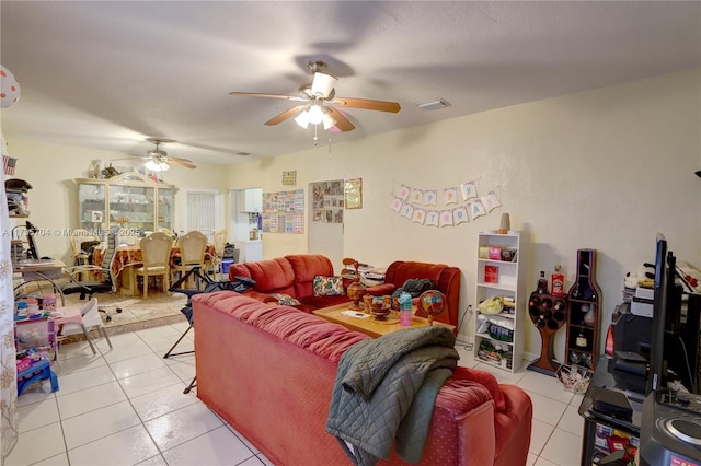 living room with ceiling fan and light tile patterned floors