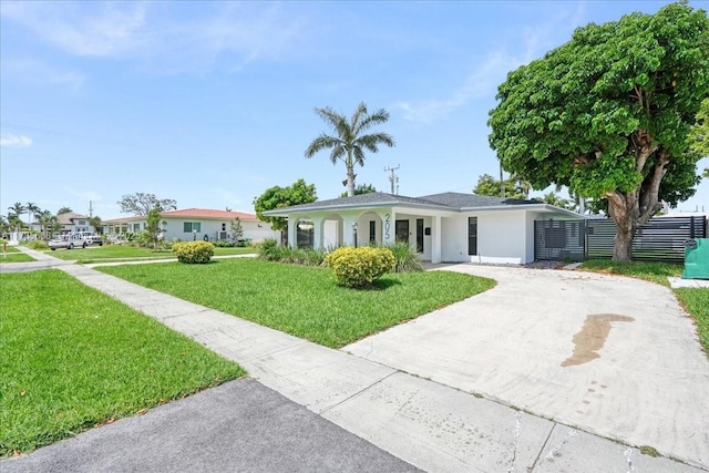 ranch-style house with a front lawn