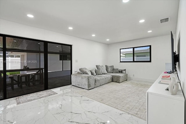 living room featuring plenty of natural light