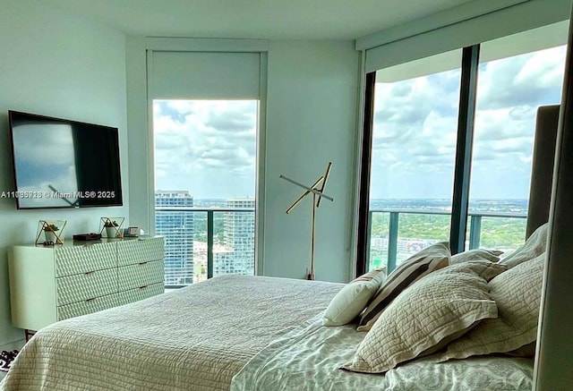 bedroom with multiple windows and floor to ceiling windows