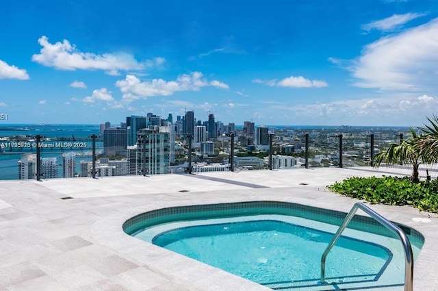 view of pool with a water view