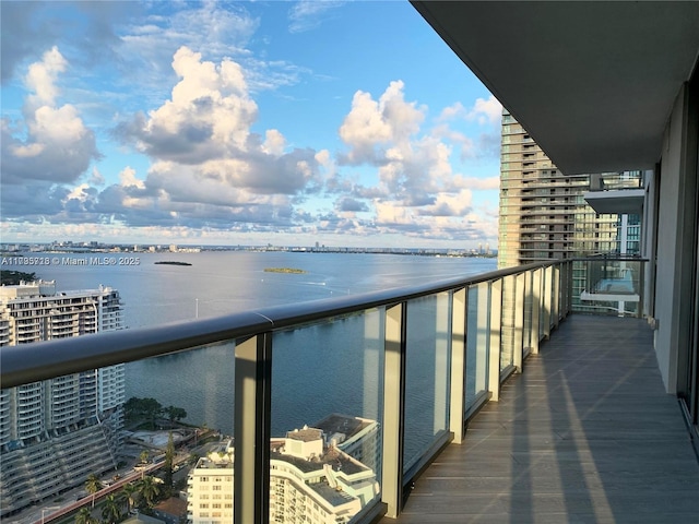 balcony featuring a water view