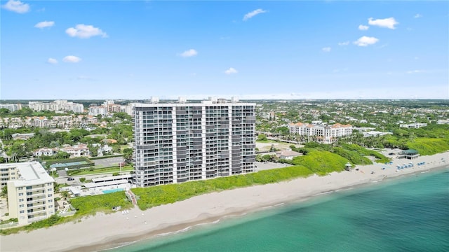 drone / aerial view featuring a view of the beach and a water view