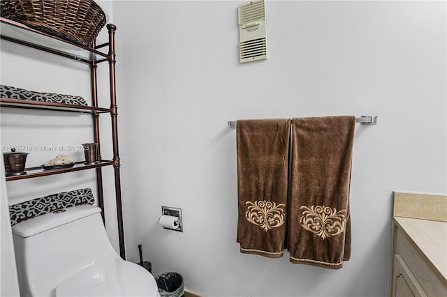 bathroom with vanity and toilet