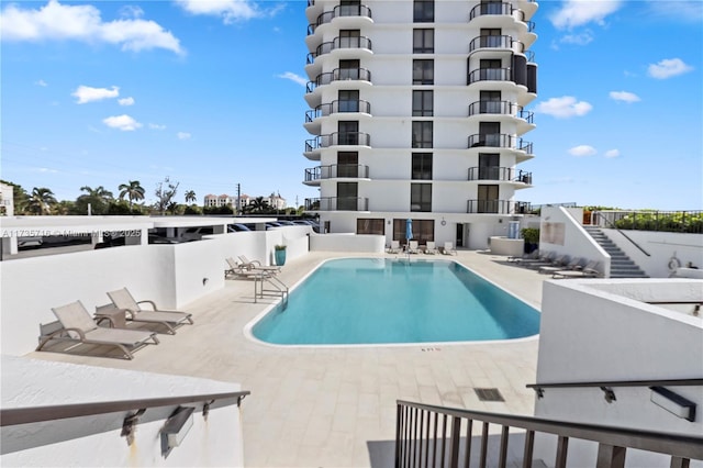 view of pool featuring a patio