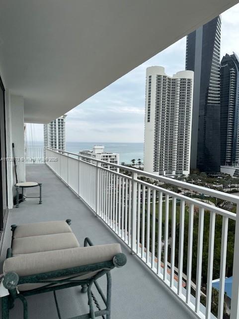 balcony featuring a water view