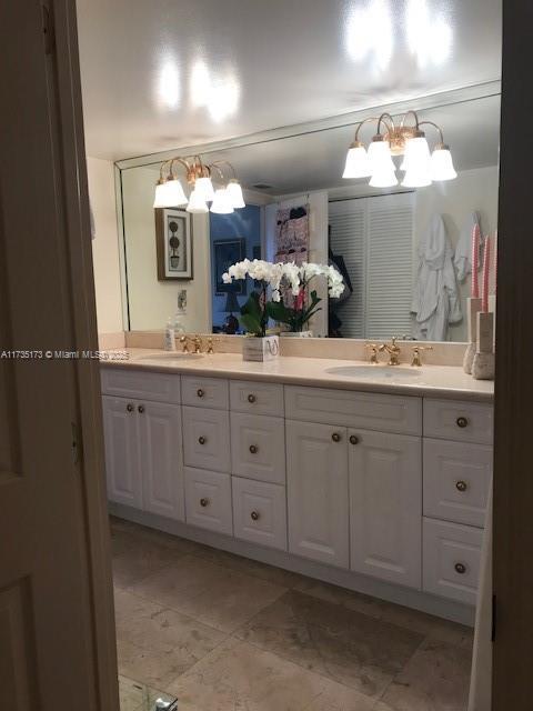 bathroom with double vanity and a sink