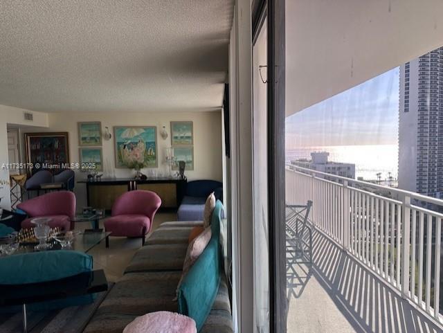 balcony featuring visible vents and an outdoor hangout area