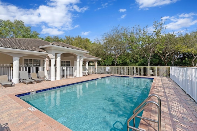 view of pool featuring a patio