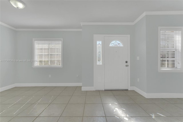 foyer featuring crown molding, a healthy amount of sunlight, and light tile patterned flooring