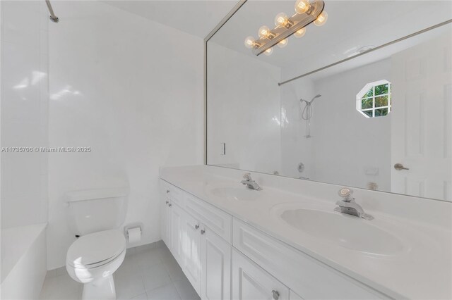 full bathroom with shower / tub combination, vanity, toilet, and tile patterned floors