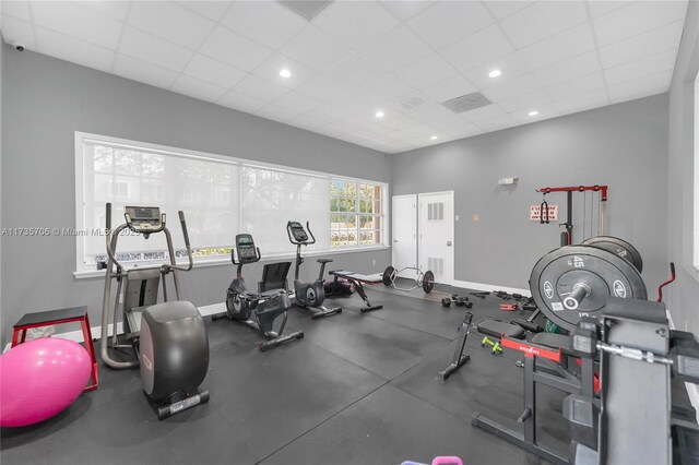 gym featuring a drop ceiling