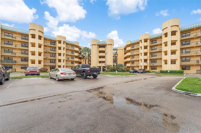 6575 W Oakland Park Blvd Unit 114, Lauderhill, FL 33313 - view of apartment building / complex with uncovered parking