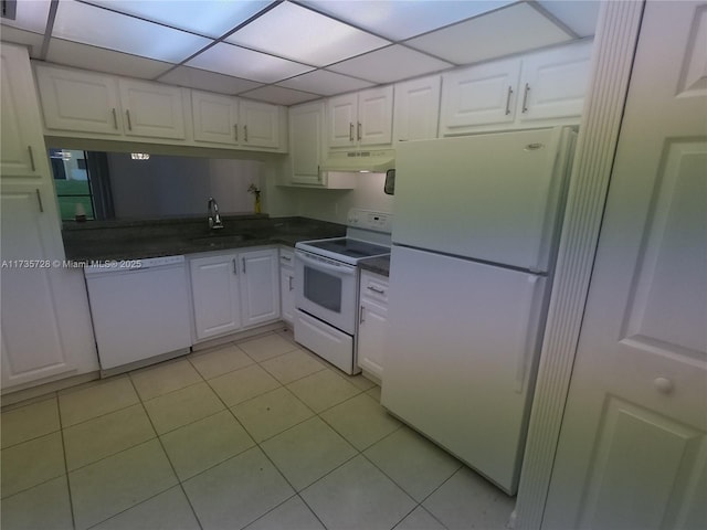 kitchen featuring white cabinetry, sink, white appliances, and light tile patterned floors