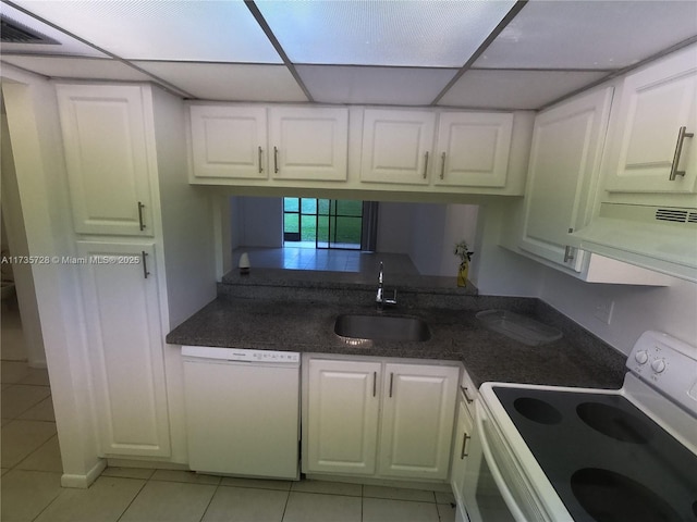 kitchen with white cabinetry, exhaust hood, and white appliances