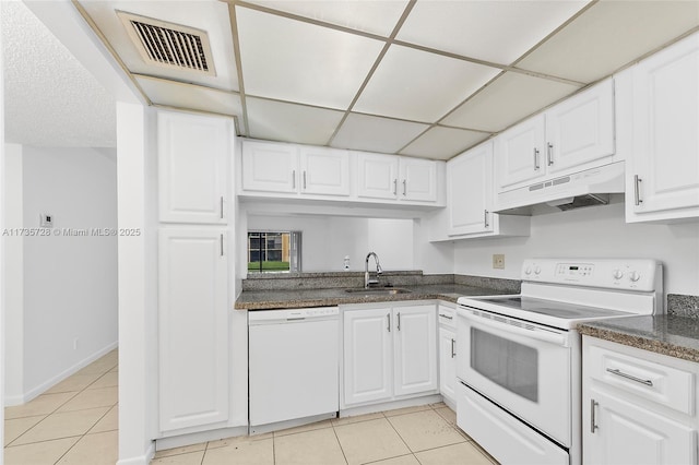 6575 W Oakland Park Blvd Unit 114, Lauderhill, FL 33313 - kitchen featuring under cabinet range hood, white appliances, light tile patterned floors, and white cabinets