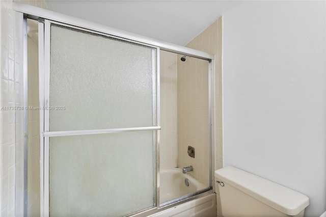 6575 W Oakland Park Blvd Unit 114, Lauderhill, FL 33313 - full bathroom with toilet and bath / shower combo with glass door