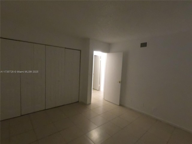 unfurnished bedroom with a closet