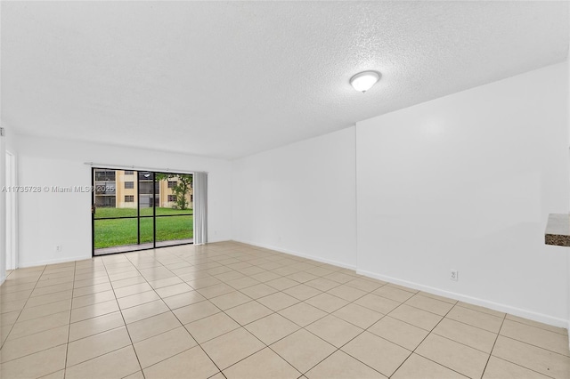 6575 W Oakland Park Blvd Unit 114, Lauderhill, FL 33313 - spare room featuring a textured ceiling and light tile patterned floors