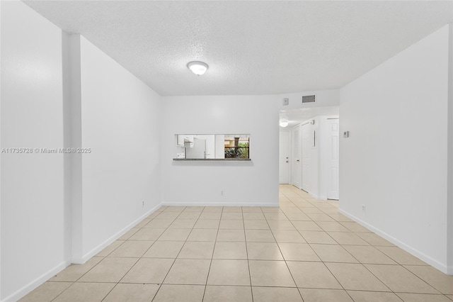 6575 W Oakland Park Blvd Unit 114, Lauderhill, FL 33313 - unfurnished room with a textured ceiling and light tile patterned floors