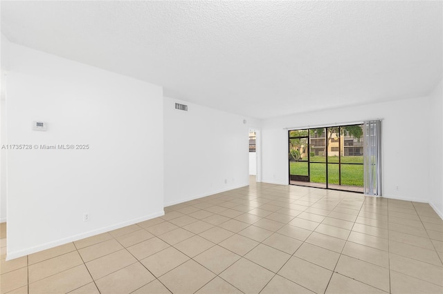 6575 W Oakland Park Blvd Unit 114, Lauderhill, FL 33313 - unfurnished room with light tile patterned floors and baseboards