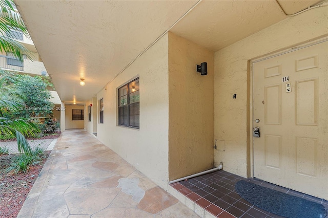 6575 W Oakland Park Blvd Unit 114, Lauderhill, FL 33313 - view of exterior entry featuring stucco siding