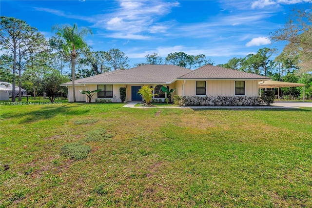 ranch-style house with a front yard and a carport