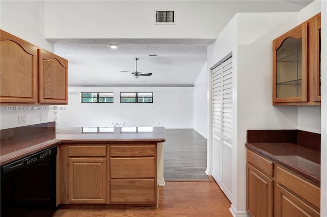 kitchen featuring black dishwasher, kitchen peninsula, ceiling fan, and light hardwood / wood-style flooring