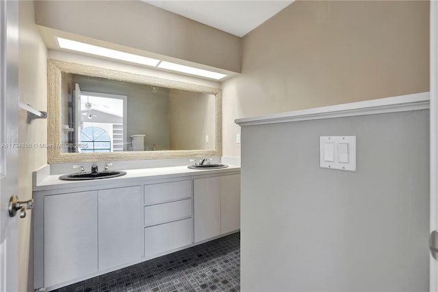 bathroom featuring vanity and a skylight