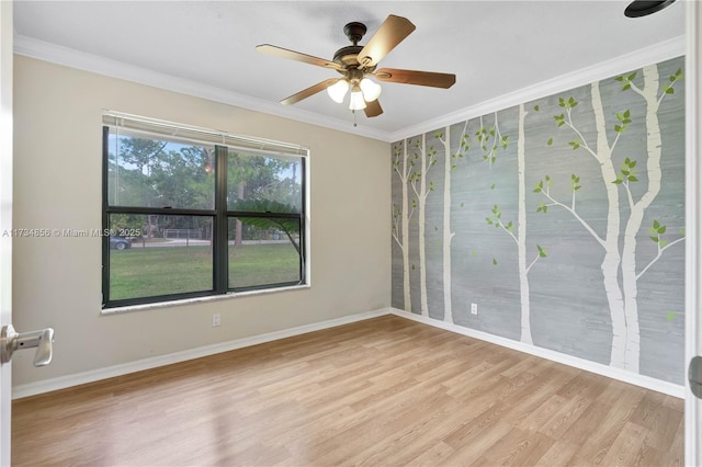 empty room with crown molding, ceiling fan, and light wood-type flooring