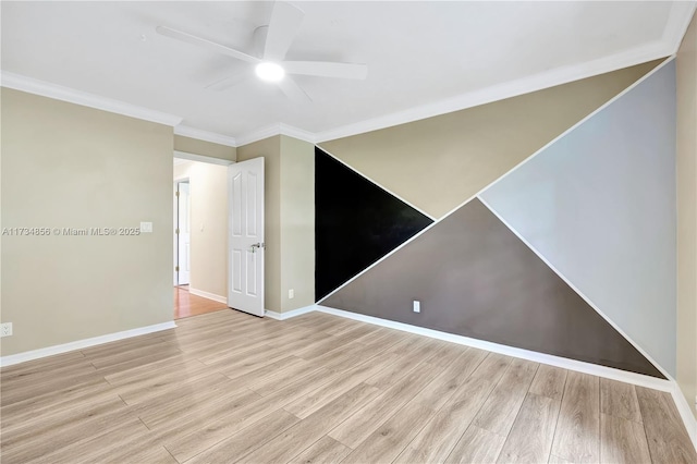 unfurnished room featuring crown molding, ceiling fan, and light wood-type flooring