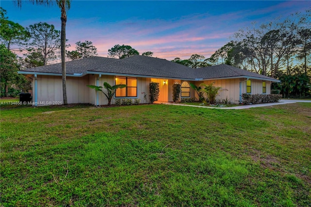 ranch-style house featuring a yard