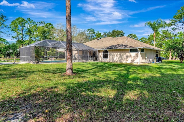 13230 N 153rd Rd N, Jupiter, FL 33478 - back of house with a lawn, an outdoor pool, and glass enclosure