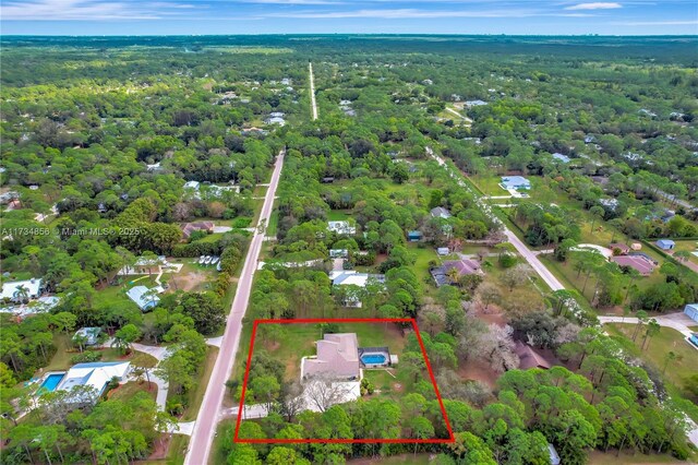 13230 N 153rd Rd N, Jupiter, FL 33478 - aerial overview of property's location with a forest and property boundaries highlighted