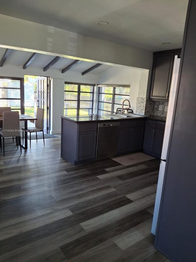 kitchen with sink, dark hardwood / wood-style flooring, stainless steel fridge, black dishwasher, and beam ceiling