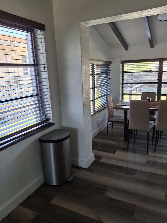 dining room featuring vaulted ceiling with beams and dark wood-type flooring