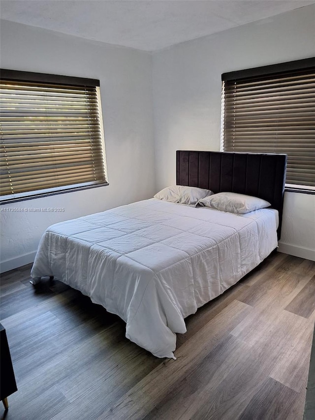 bedroom featuring dark hardwood / wood-style floors