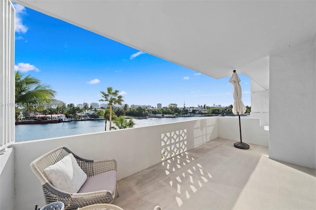 balcony featuring a water view