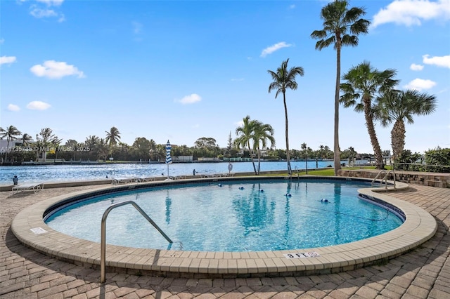 view of pool with a water view