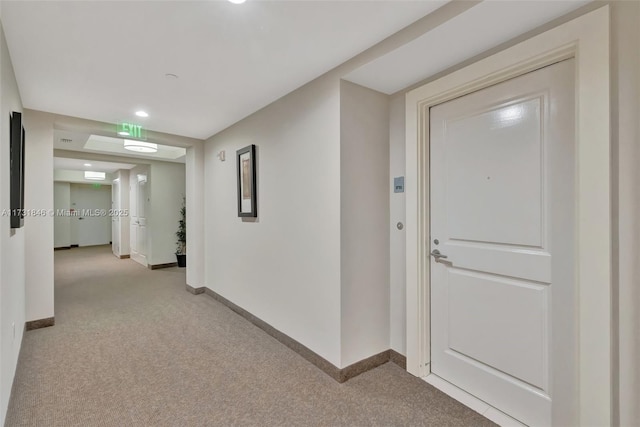 hallway featuring light carpet