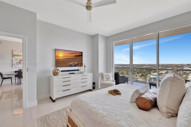 tiled bedroom featuring ceiling fan