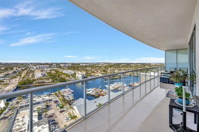 balcony featuring a water view