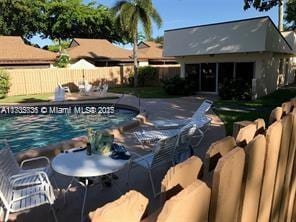 view of pool featuring a patio