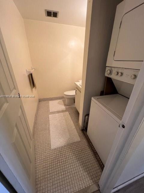 bathroom with tile patterned floors, toilet, and vanity