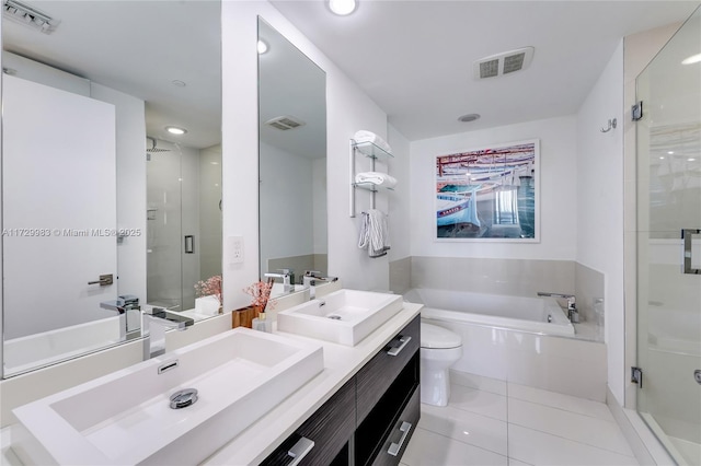 full bathroom featuring tile patterned flooring, vanity, plus walk in shower, and toilet