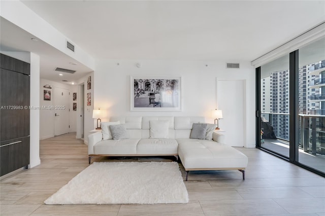 living room with floor to ceiling windows