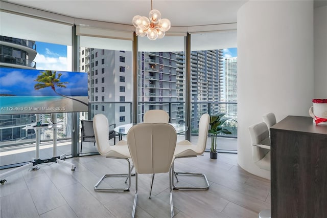 dining space featuring expansive windows and a notable chandelier